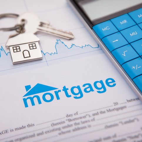 An empty mortgage application form with house key